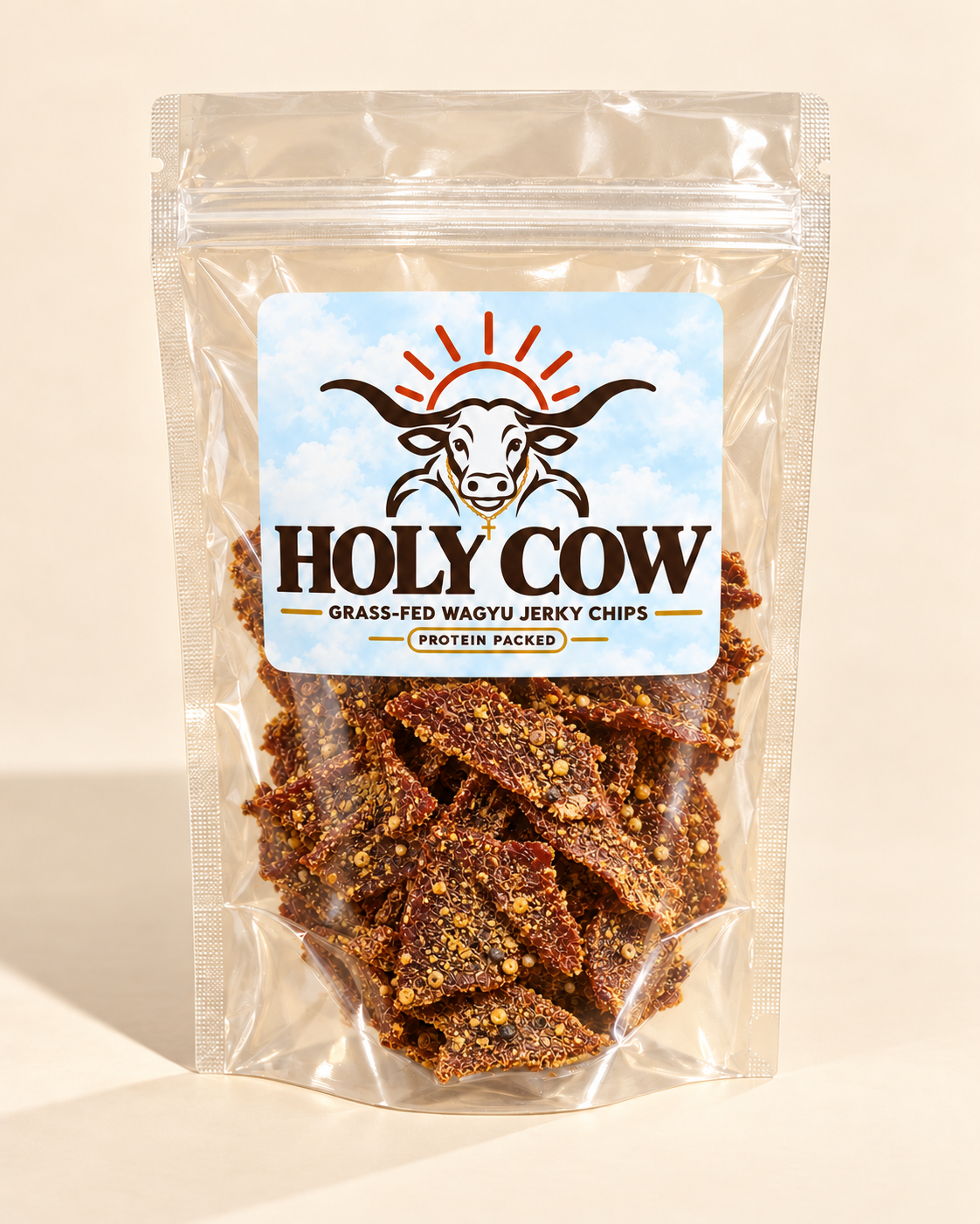 Spicy Lemon Pepper jerky chips visible through a clear pouch with a cloudy blue Holy Cow label